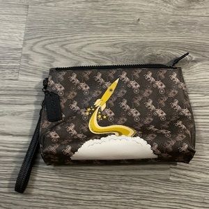 Coach rocket zipper with wrist strap